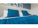 Comfortable and inviting primary bedroom with a plush bed, stylish bedding, and artwork at 3326 Arch Ave, Ormond Beach, FL 32174