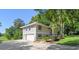 Two-story home with a two-car garage, neutral paint and well-maintained landscaping at 33925 Highland Rd, Leesburg, FL 34788