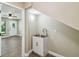 Small laundry room area featuring a utility sink, with view to the adjacent bedroom space at 33925 Highland Rd, Leesburg, FL 34788