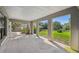 View of the covered patio with concrete floors, neutral walls, pillars, and view of backyard at 33925 Highland Rd, Leesburg, FL 34788