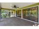 Spacious screened-in porch with beautiful nature views offers relaxation and bug-free enjoyment at 33925 Highland Rd, Leesburg, FL 34788