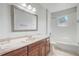 Bathroom features a marble countertop and a bathtub with showerhead at 3539 Foxcroft Cir, Oviedo, FL 32765