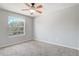 Bright bedroom featuring neutral walls and carpet, a ceiling fan, and ample natural light at 3539 Foxcroft Cir, Oviedo, FL 32765