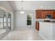 Bright dining area features sliding glass doors and complements the updated kitchen at 3539 Foxcroft Cir, Oviedo, FL 32765