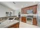 Well-equipped kitchen featuring granite countertops and stainless steel appliances at 3539 Foxcroft Cir, Oviedo, FL 32765