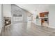 Bright living room with a cozy fireplace and an open layout to the kitchen, perfect for entertaining at 3539 Foxcroft Cir, Oviedo, FL 32765