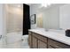 Bright bathroom featuring a combined bathtub and shower, neutral tiling, and modern fixtures at 3814 Blue Vale Dr, Davenport, FL 33837