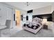 Charming bedroom with a pink bed, black and white accents, and an en-suite bathroom at 3814 Blue Vale Dr, Davenport, FL 33837
