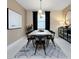 Modern dining room with contemporary decor, ample seating, and stylish lighting fixtures at 3814 Blue Vale Dr, Davenport, FL 33837