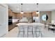 Modern kitchen with stainless steel appliances, an island, and stylish pendant lighting at 3814 Blue Vale Dr, Davenport, FL 33837