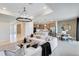 Bright, open-concept living room and kitchen with modern furnishings and stylish decor at 3814 Blue Vale Dr, Davenport, FL 33837