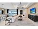Spacious living room features an open floor plan, modern furnishings, and large windows at 3814 Blue Vale Dr, Davenport, FL 33837