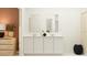 Modern bathroom featuring double sinks, neutral wall color, and modern decor at 455 Puma Loop, Groveland, FL 34736