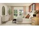 Bright bedroom featuring neutral colors, lots of natural light, and stylish decor at 455 Puma Loop, Groveland, FL 34736