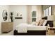 Stylish bedroom showcasing decor, neutral tones, and ample natural light at 455 Puma Loop, Groveland, FL 34736