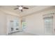 This bedroom is light and airy, with doors leading to the pool area at 4735 Chelsea Ct, Kissimmee, FL 34744