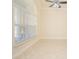 An empty bedroom with neutral paint, tile floor and large window at 4735 Chelsea Ct, Kissimmee, FL 34744