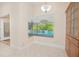 Bright dining area with tile floors and pool view window at 4735 Chelsea Ct, Kissimmee, FL 34744