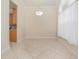 The dining room is bright with tile floor and a charming light fixture at 4735 Chelsea Ct, Kissimmee, FL 34744