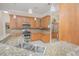 Kitchen features stainless appliances, wooden cabinets, and granite countertops at 4735 Chelsea Ct, Kissimmee, FL 34744