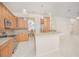 Modern kitchen with stainless steel appliances, granite countertops, and tile flooring at 4735 Chelsea Ct, Kissimmee, FL 34744