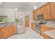 Charming kitchen features stainless appliances, tile backsplash, and ample countertop space at 4735 Chelsea Ct, Kissimmee, FL 34744