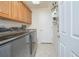 Modern laundry room with washer, dryer, and cabinets at 4735 Chelsea Ct, Kissimmee, FL 34744