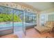 Screened-in porch overlooking a sparkling pool and lush landscaping at 4735 Chelsea Ct, Kissimmee, FL 34744