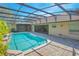 Inviting pool area with screened enclosure and well-maintained patio at 4735 Chelsea Ct, Kissimmee, FL 34744