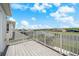 Balcony overlooking neighborhood homes, pool enclosures, and a scenic pond at 4785 Cumbrian Lakes Dr, Kissimmee, FL 34746