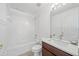 Clean bathroom featuring a bathtub, shower, and granite counter vanity at 4785 Cumbrian Lakes Dr, Kissimmee, FL 34746