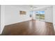 Bright bedroom with wood-style floors and access to a private balcony with outdoor views at 4785 Cumbrian Lakes Dr, Kissimmee, FL 34746