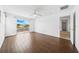 Spacious bedroom with wood-style floors and a sliding glass door to a balcony at 4785 Cumbrian Lakes Dr, Kissimmee, FL 34746