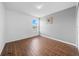 Comfortable bedroom with wood-style floors and a window for natural light at 4785 Cumbrian Lakes Dr, Kissimmee, FL 34746