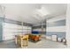 Spacious garage with games: pool table, foosball, and blue and gray accents. Perfect for Gathering fun at 4785 Cumbrian Lakes Dr, Kissimmee, FL 34746