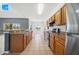 Eat-in kitchen featuring ample counter space, stainless steel appliances, and a view of the backyard at 4785 Cumbrian Lakes Dr, Kissimmee, FL 34746