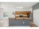Kitchen with stainless steel refrigerator, wood cabinets and a breakfast bar at 4785 Cumbrian Lakes Dr, Kissimmee, FL 34746