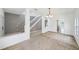 Open living room with neutral carpet and a view to the staircase and kitchen at 4785 Cumbrian Lakes Dr, Kissimmee, FL 34746
