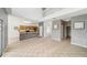 Open living room with a view to kitchen, stairwell and front entry at 4785 Cumbrian Lakes Dr, Kissimmee, FL 34746