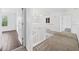 Bright and spacious loft area with hardwood and carpet flooring, perfect for versatile living at 4785 Cumbrian Lakes Dr, Kissimmee, FL 34746
