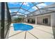 Screened-in pool with patio, exterior balcony, and water views at 4785 Cumbrian Lakes Dr, Kissimmee, FL 34746