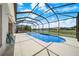 Screened-in pool and patio area with views of water and sky at 4785 Cumbrian Lakes Dr, Kissimmee, FL 34746