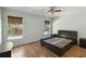 Bedroom with hardwood floors, large windows, and a modern platform bed at 4806 Gallant Ln, Orlando, FL 32821