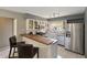 Updated kitchen with stainless steel appliances, butcher block countertops, and breakfast bar at 4806 Gallant Ln, Orlando, FL 32821