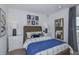 Cozy bedroom with nautical themed decor and large window at 4859 Sunflower St, Lake Hamilton, FL 33851