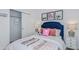Charming bedroom with sports themed decor, plush bedding, and bedside tables at 4859 Sunflower St, Lake Hamilton, FL 33851
