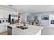 Kitchen island with stainless steel appliances, seating, and ample counter space at 4859 Sunflower St, Lake Hamilton, FL 33851