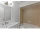 Updated bathroom features a shower over bath and a vanity with modern hardware at 4878 Tangerine Ave # 4878, Winter Park, FL 32792