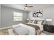 Bedroom featuring soft, natural light, wood floors, neutral gray walls and luxurious decor at 4878 Tangerine Ave # 4878, Winter Park, FL 32792