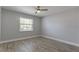 Inviting bedroom featuring neutral colors, ceiling fan, and wood-look flooring at 4878 Tangerine Ave # 4878, Winter Park, FL 32792